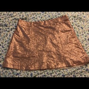 Gold glitter/sequence mini skirt.